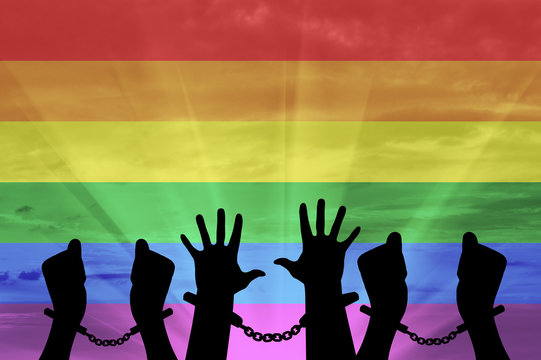 Silhouette gay hands in handcuffs