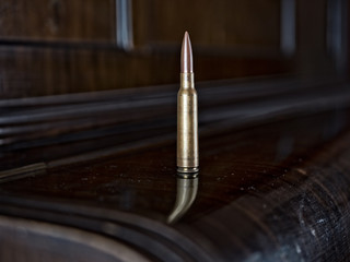 Bullet on wooden table