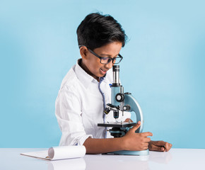 indian boy and microscope, asian boy with microscope, Cute little kid holding microscope, 10 year old indian boy and science experiment, boy doing science experiments