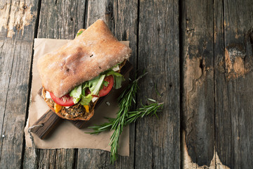 Sandwich with meat, pesto and goat cheese