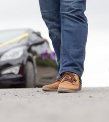 male legs in jeans and shoes