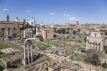 Fototapeta na wymiar The Roman Forum is in Rome, Italy. It was center of ancient Rome. It served as a public area in which commercial, religious, economic, legal and political activities occurred.