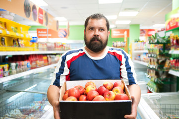 The man in the store bought apples 
