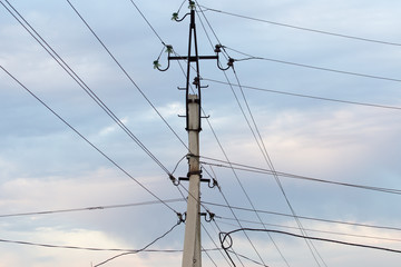 Fototapeta premium Mast electrical power line against cloud and blue sky