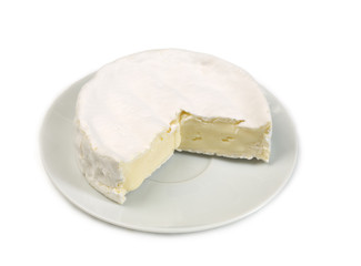 Round camembert cheese with a cut out piece