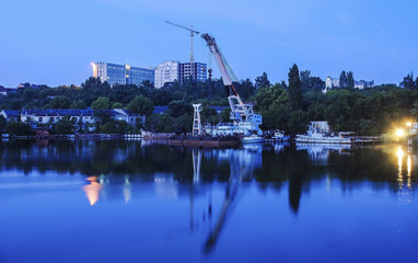 Industrial kind of reflection in the water. Shipbuilding Plant in Nikolayev, Ukraine
