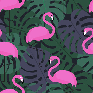 Tropical seamless pattern with pink flamingos on dark monstera leaves background. Exotic Hawaii art background. Fashion design for fabric and decor.