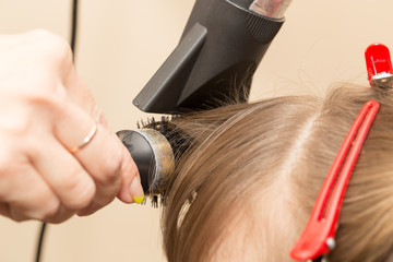 blow-drying in a beauty salon