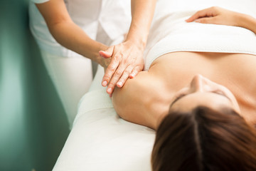 Obraz na płótnie Canvas Woman getting an arm massage at a spa