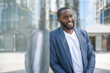 Attractive African businessman resting after work