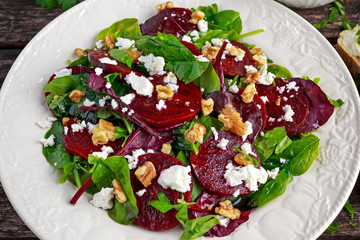 Healthy Beet Salad with fresh sweet baby spinach, kale lettuce, nuts, feta cheese and toast  melted 