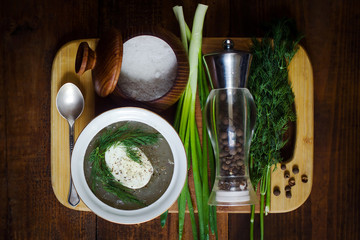 Aspic with boiled egg and greens on the board 