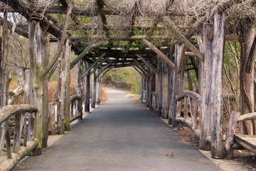 Rustic wood arbor and path at Prospect Park in Brooklyn, New York City