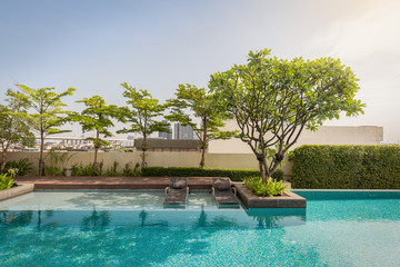 Relax zone on water surface on mosaic swimming pool