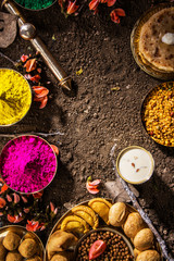 holi festival food with colours, indian festival holi, samosa, kachori, laddu, gujiya, palash...