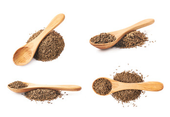 Wooden spoon over the pile of cumin