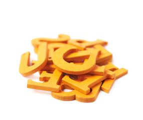 Pile of painted wooden letters isolated
