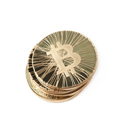Pile of bitcoin currency tokens isolated