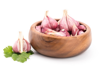 Garlic on wooden bowl