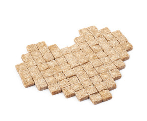 Heart shape made of sugar cubes isolated