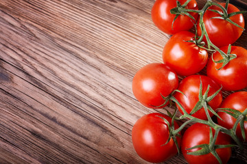 Juicy tomatoes on a wooden table