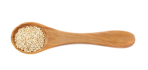 Spoon filled with quinoa seeds isolated