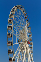 Bangkok, Thailand - April 15th, 2016 : Ferris wheels with blue s
