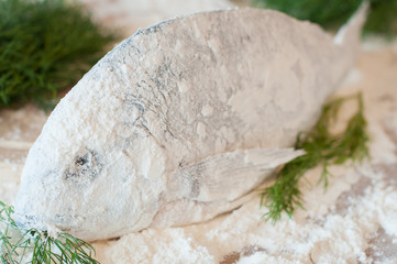 raw fish dorado flour close-up