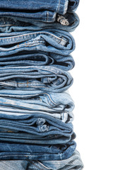 stack of jeans on white background