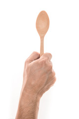 Men hand holding wooden spoon on white background