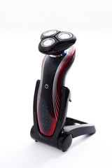 Electric shaver over white background
