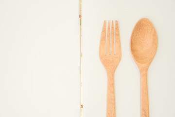 Closeup blank notebook for recipe with wooden spoon and fork