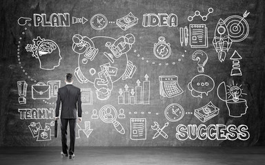 Man looking at success drawing