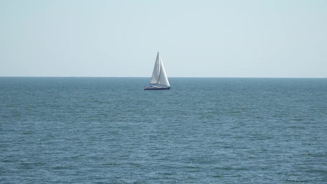 The yacht is under sail floats on the high seas.