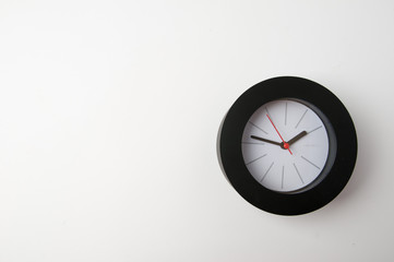 Obraz na płótnie Canvas Black clock isolated on a white background