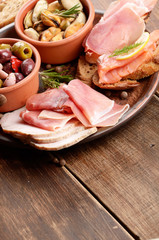 Tapas of salmon, mussels, jamon and olives