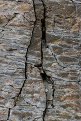 .Stone wall of rock with cracks