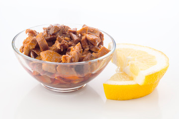 squid sauce with lemon on white