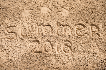 summer 2016 - an inscription a hand on sea sand