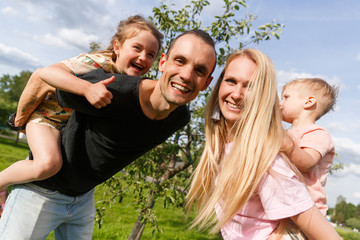 Fototapeta premium Happy family with children outdoors