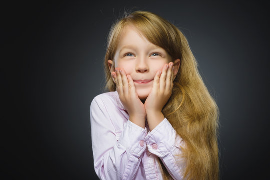 Closeup Portrait happy girl going surprise isolated on gray background
