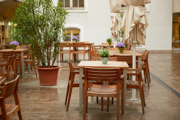 Fototapeta na wymiar tables of street cafes in Italy