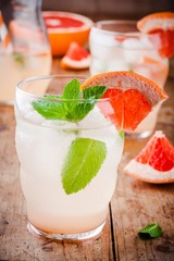 cold grapefruit cocktail with mint in glass