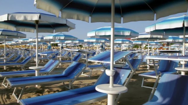 Adriatic beach umbrellas and sunbeds