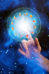Astrology with zodiac circle and a female hand