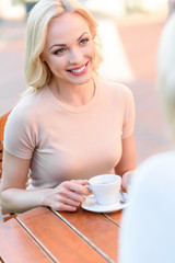 Joyful young lady talking with parent