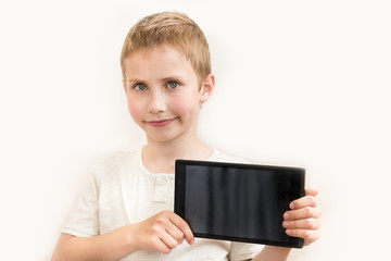 white boy shows tablet and smiling