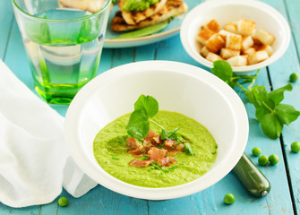 Soup of green peas with bacon and mint.