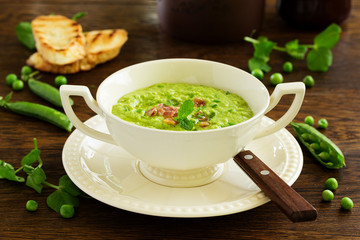 Soup of green peas with bacon and mint.