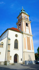 Fototapeta na wymiar Church of Saint John The Baptist ( Stolnica svetega Janeza Krstnika ) , Slomsek square ( Slomskov trg ), Maribor, Slovenia - front side of religious building made in gothic and baroque style